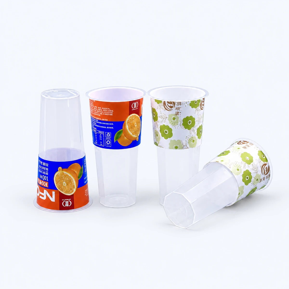 Decorated transparent plastic cups showing label coverage