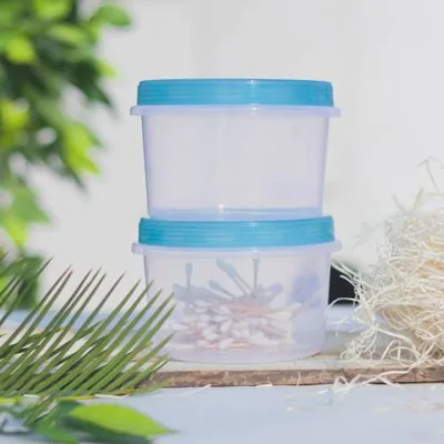 Clear cylindrical storage containers with blue lids