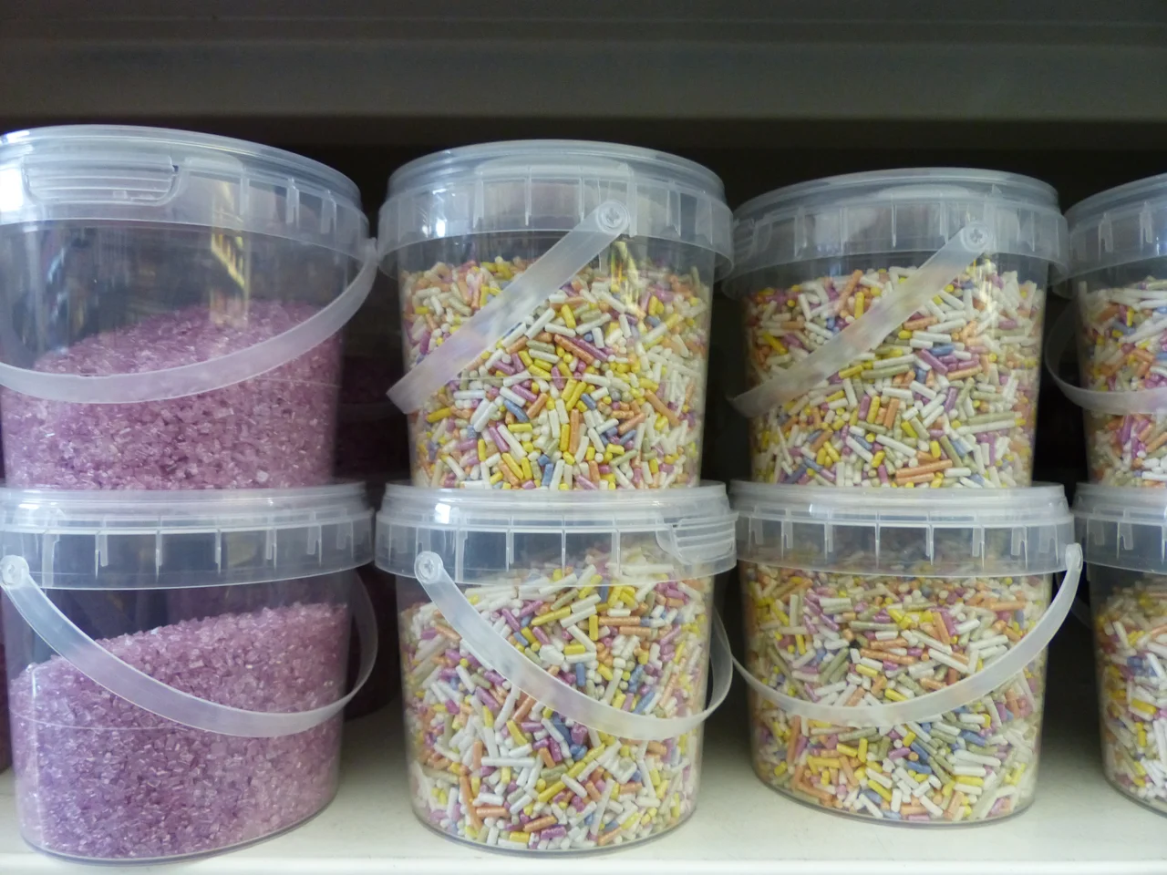 Clear ingredient pails with lids and handles — third-party photographic reference