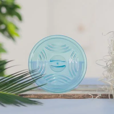 Blue round plastic lid showing its raised surface pattern