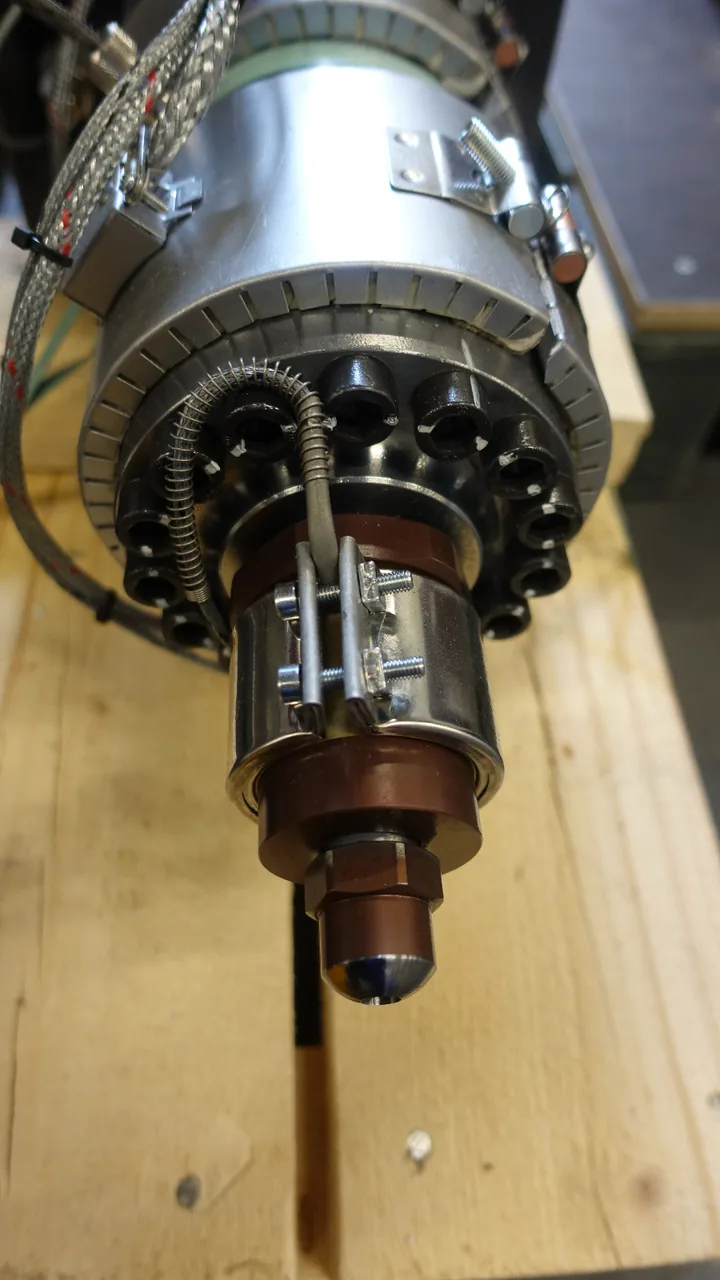 Close view of a plastic injection molding barrel and injection unit