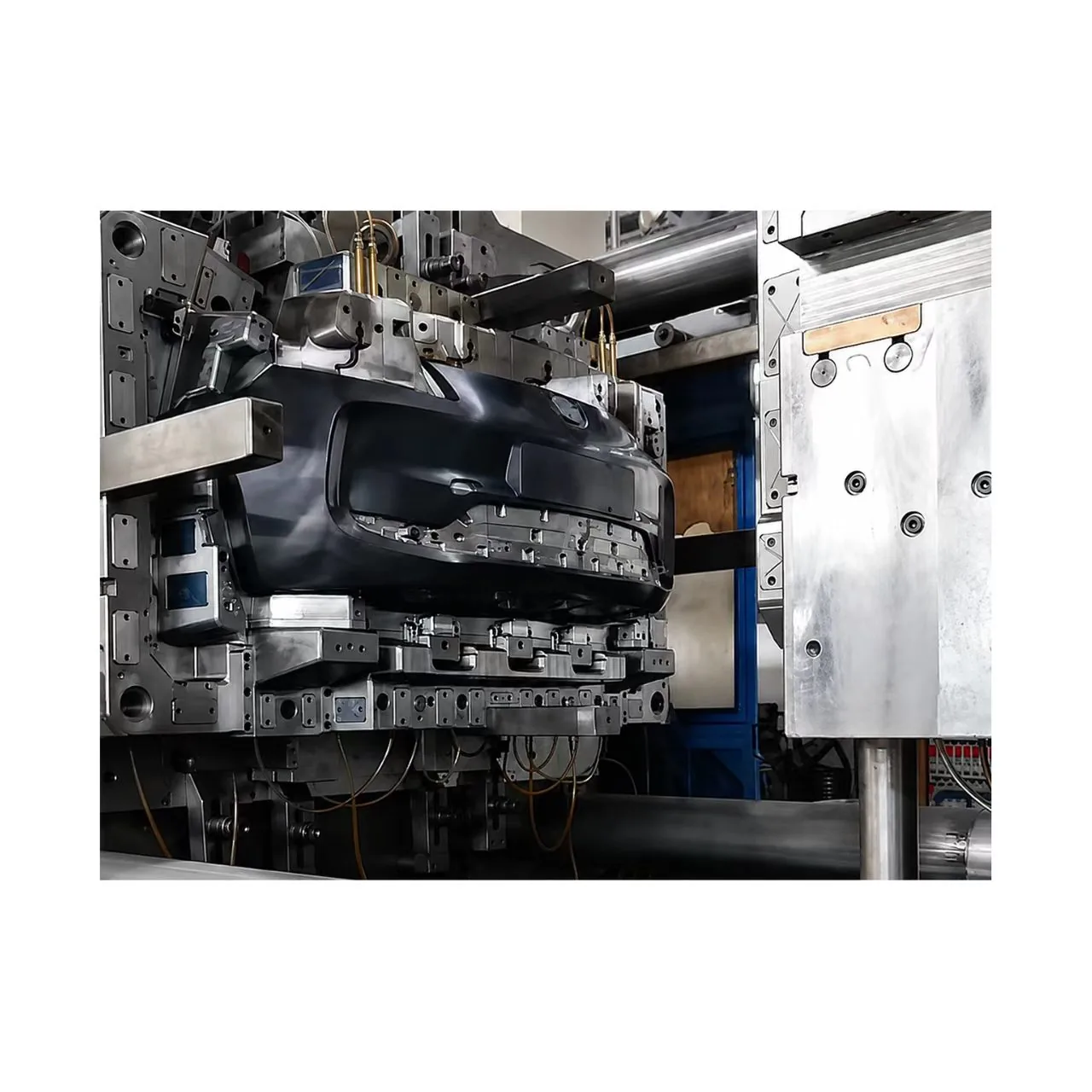 An injection mold installed inside a molding press