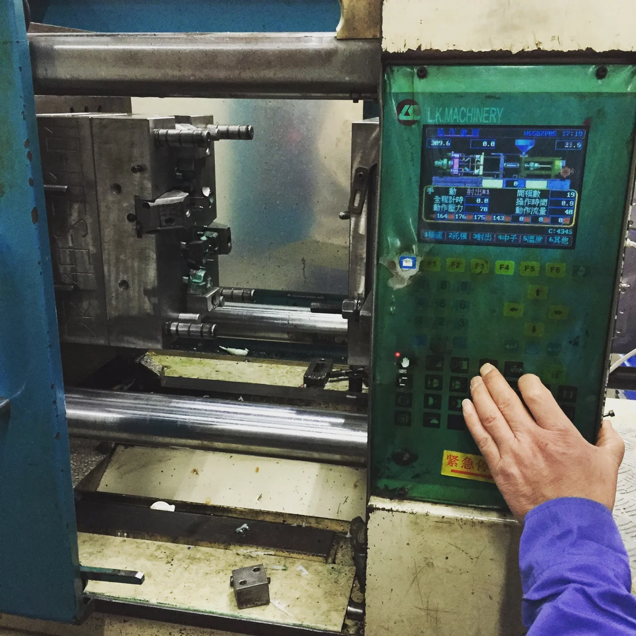 Operator checking injection molding controls