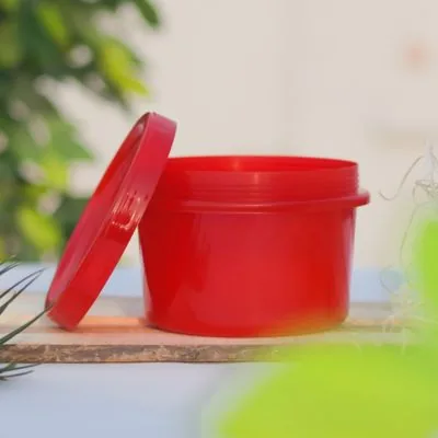 Opaque red round storage pot with matching lid