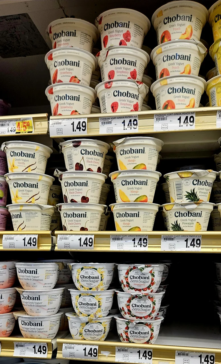 Plastic yogurt tubs in a retail display — third-party photographic reference